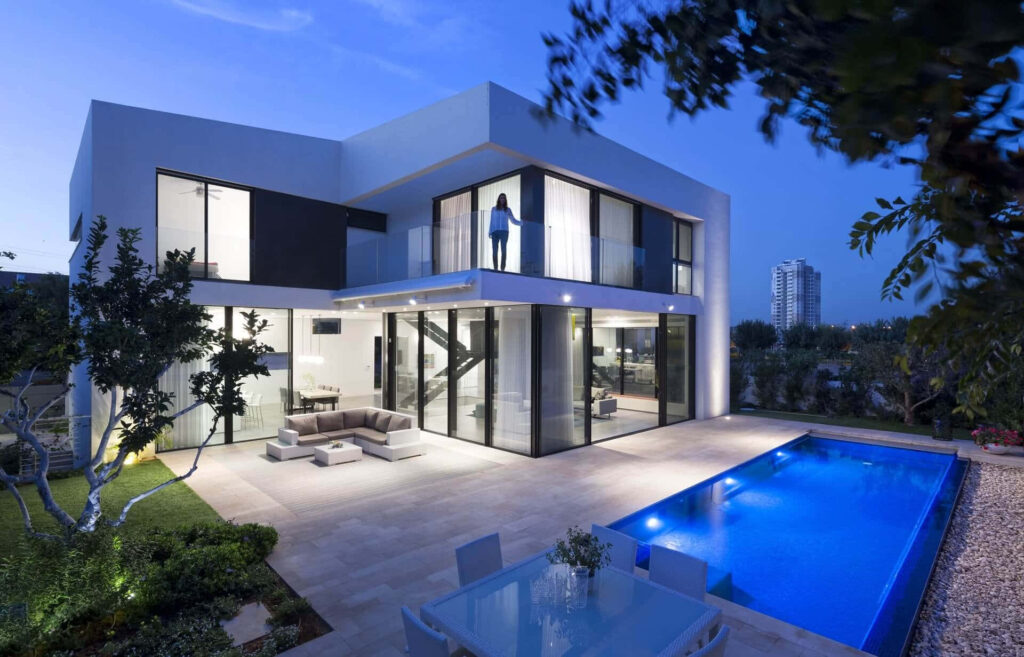 Modern duplex house designs in Nigeria with beautiful Pool in backyard full blue vibe