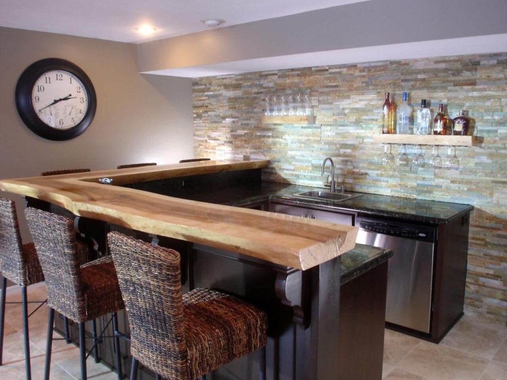 u shaped bar kitchen in basement with stone