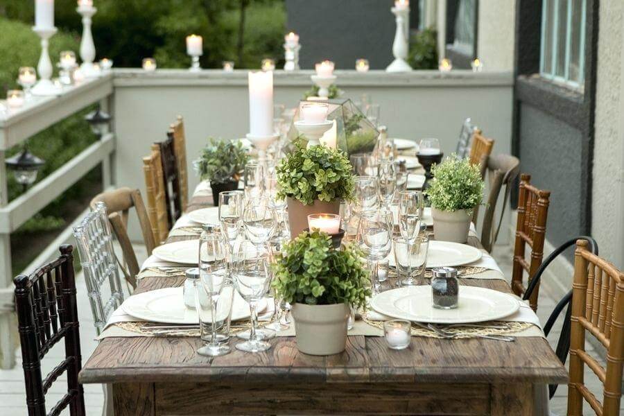 Setting Table For Dinner Party : Woman Setting Table At Dinner Party