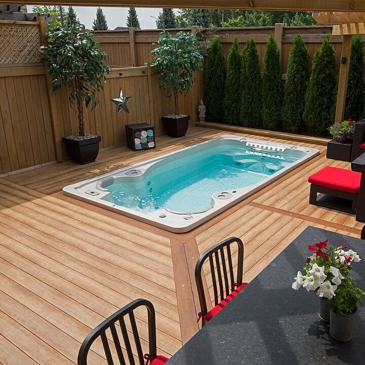 Seating and Hot tube With a Plunge Pool and Deck Around it