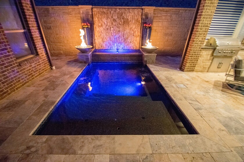 Innovate Blue Pool Light integration in Backyard with Outdoor Firepit