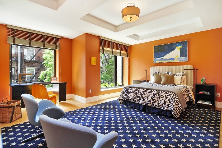 Persimmon Orange, Blue and Light Wood interior of Bedroom