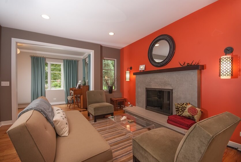Burnt Orange, Gray and Cream interior Living Room with Fireplace