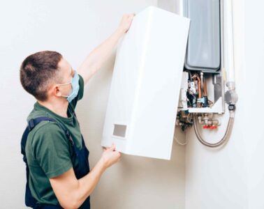 plumber-attaches-trying-fix-problem-with-residential-heating-equipment-repair-gas-boiler