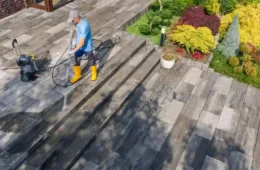 “Removing winter salt stains from a concrete driveway using pressure washing cleaning method.”