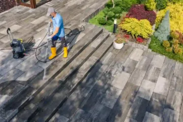 “Removing winter salt stains from a concrete driveway using pressure washing cleaning method.”