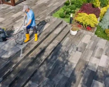 “Removing winter salt stains from a concrete driveway using pressure washing cleaning method.”